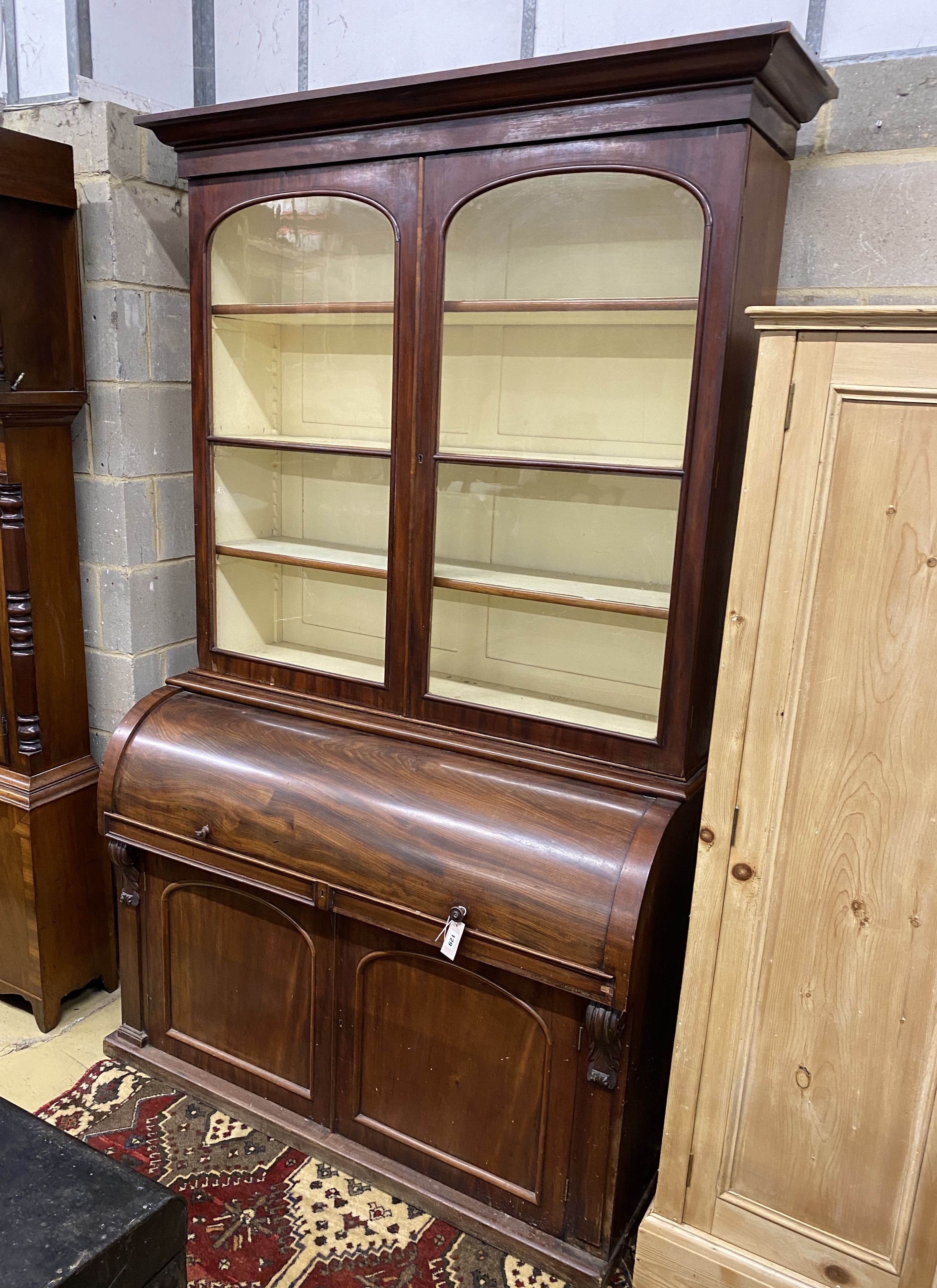 A Victorian mahogany cylinder bureau bookcase, width 130cm, depth 59cm, height 216cm